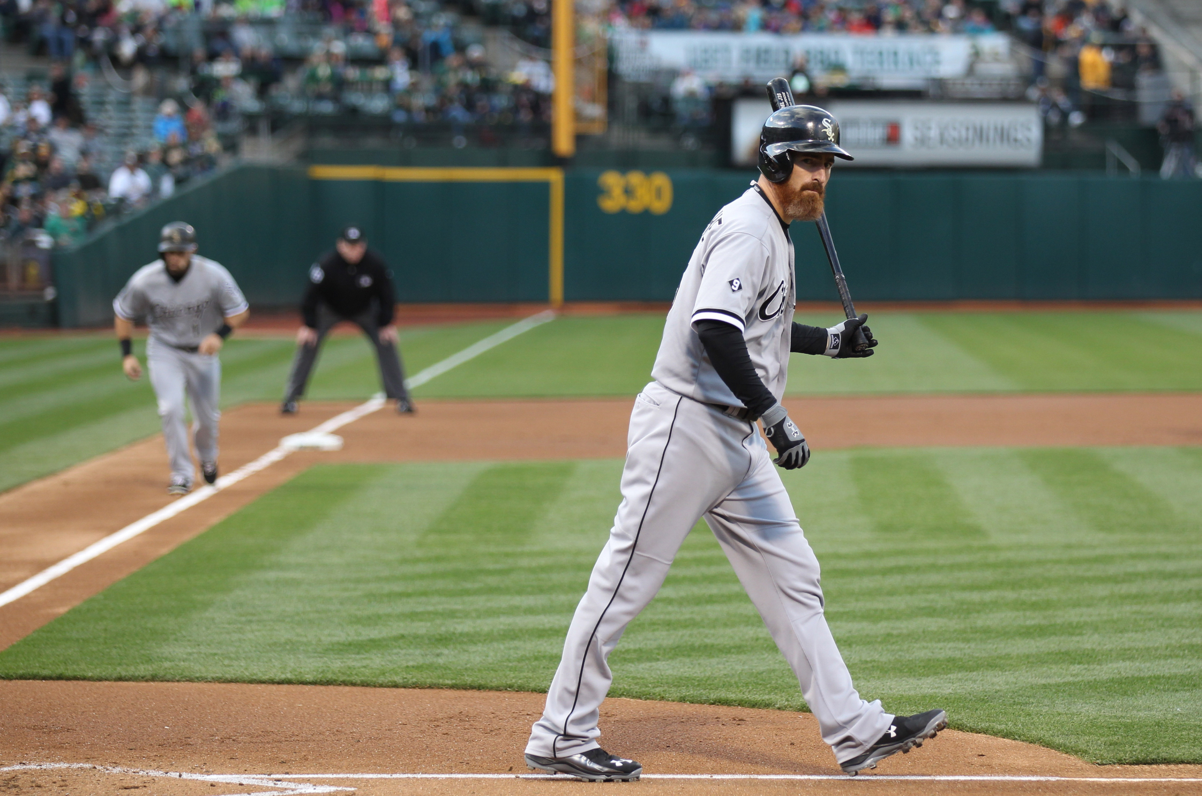 May 15, 2015; Oakland, CA, USA; Chicago White Sox designated hitter Adam LaRoche (25) earns a walk with bases loaded t send in Chicago White Sox center fielder Adam Eaton (1) for a run against the Oakland Athletics during the first inning at O.co Coliseum. Mandatory Credit: Kelley L Cox-USA TODAY Sports